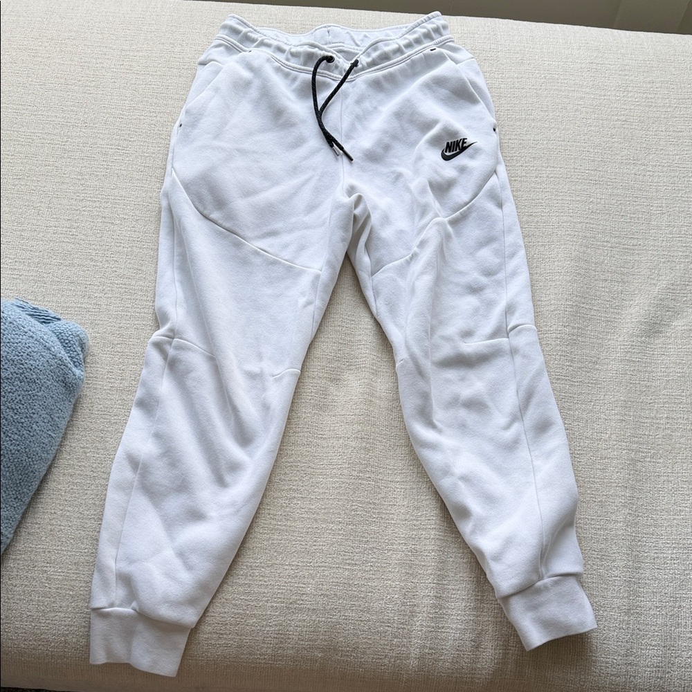 White Nike Tech Sweatpants with Black Drawstring and Logo